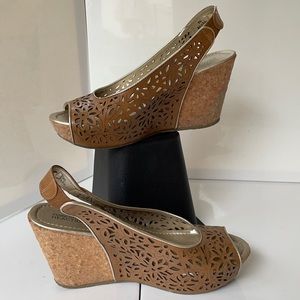 Tan and gold flower cutout wedge sandals